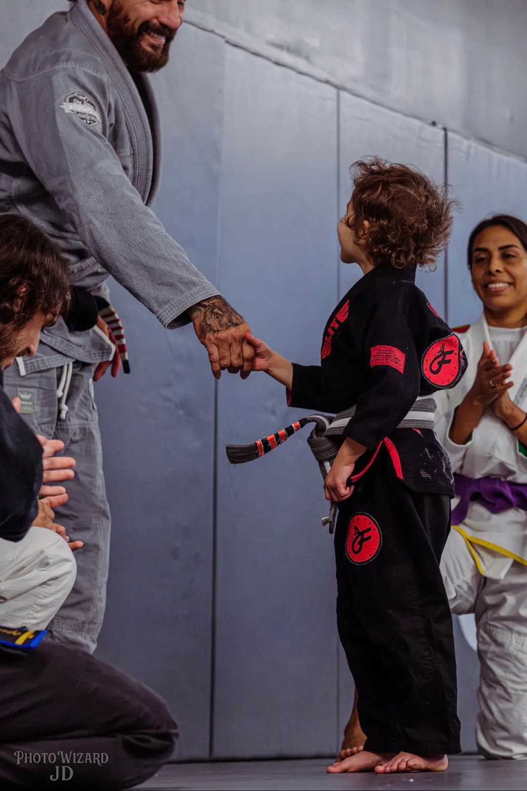 A young student shaking hands with a coach