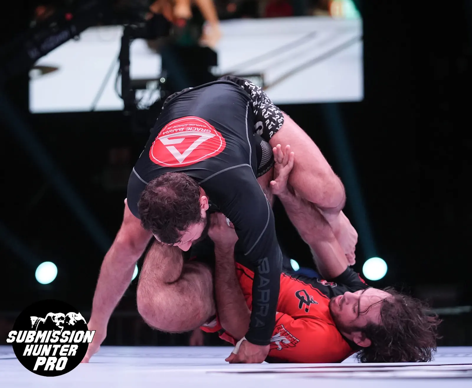 Competition grapplers working for top control